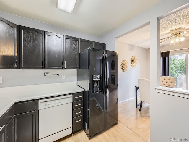 5154 E 126th Ct, Thornton, CO 80241 - kitchen featuring dishwasher, black fridge, light wood-style floors, and light countertops