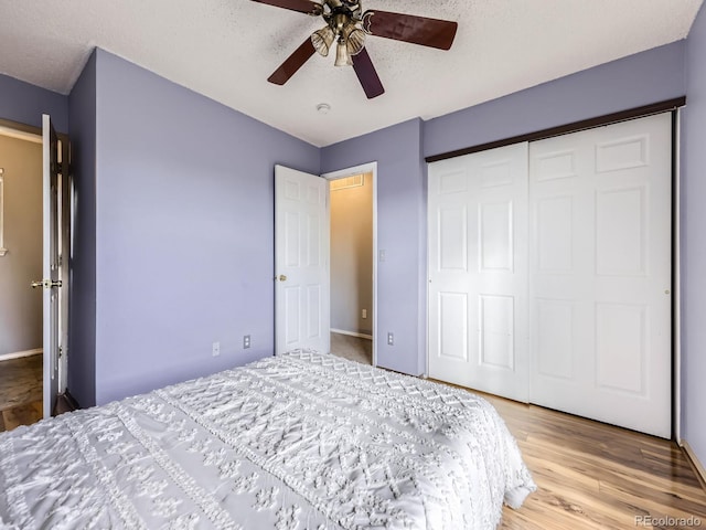 5154 E 126th Ct, Thornton, CO 80241 - bedroom with a closet, light wood-style floors, a textured ceiling, and ceiling fan