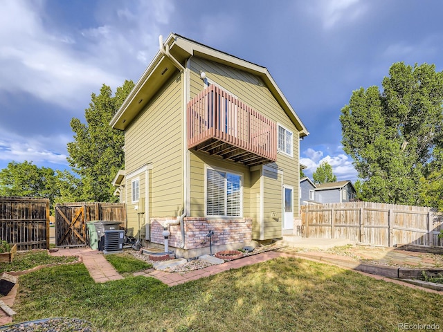 5154 E 126th Ct, Thornton, CO 80241 - back of house featuring a balcony, a gate, and a fenced backyard