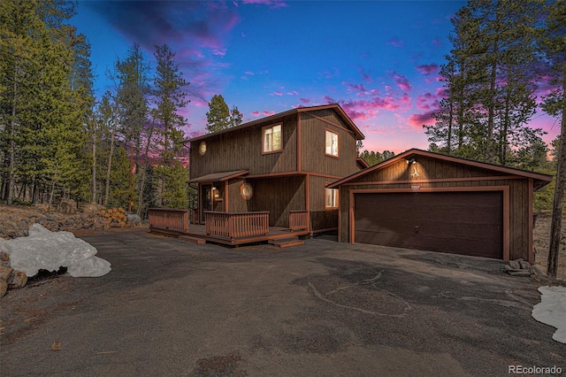 10858 Norton Ave, Conifer, CO 80433 - rustic home featuring an outbuilding, a garage, and a deck