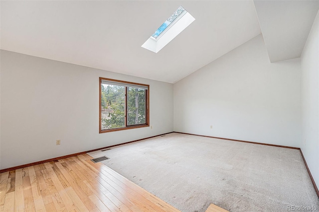 10858 Norton Ave, Conifer, CO 80433 - spare room featuring baseboards, visible vents, a skylight, and wood-type flooring