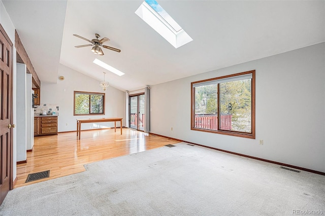 10858 Norton Ave, Conifer, CO 80433 - empty room featuring visible vents, a skylight, light colored carpet, and a wealth of natural light