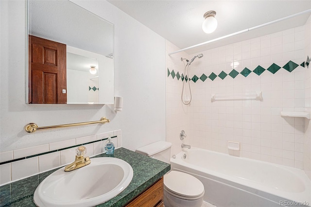 10858 Norton Ave, Conifer, CO 80433 - bathroom with backsplash, toilet, vanity, and washtub / shower combination