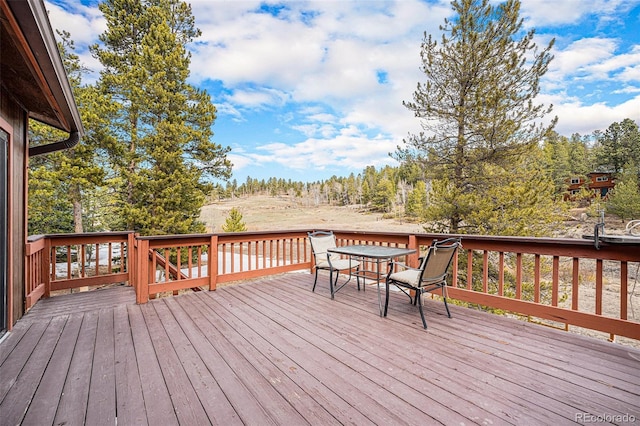 10858 Norton Ave, Conifer, CO 80433 - wooden deck featuring outdoor dining space