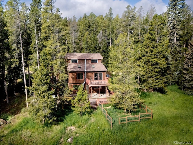 10858 Norton Ave, Conifer, CO 80433 - back of property with a wooden deck and a forest view
