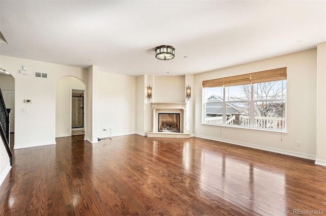 unfurnished living room featuring wood-type flooring