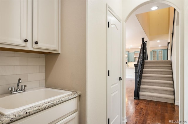 interior space featuring dark hardwood / wood-style flooring and sink