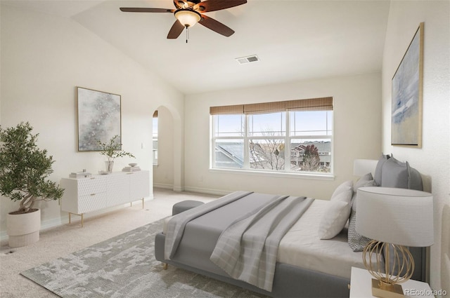 carpeted bedroom featuring ceiling fan and lofted ceiling