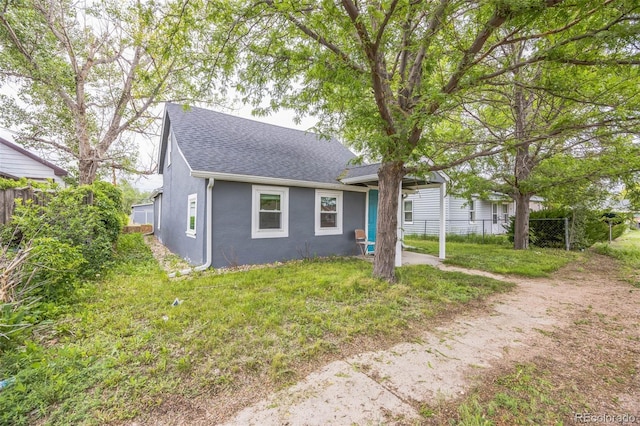 524 N 4th Ave, Sterling, CO 80751 - view of front of property featuring roof with shingles and stucco siding