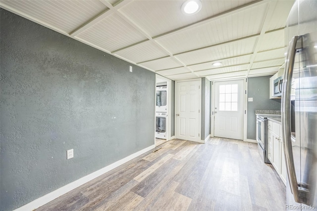524 N 4th Ave, Sterling, CO 80751 - kitchen featuring light wood-style floors, stainless steel appliances, a textured wall, and baseboards