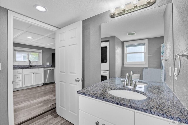 524 N 4th Ave, Sterling, CO 80751 - bathroom with a textured wall, vanity, wood finished floors, and recessed lighting