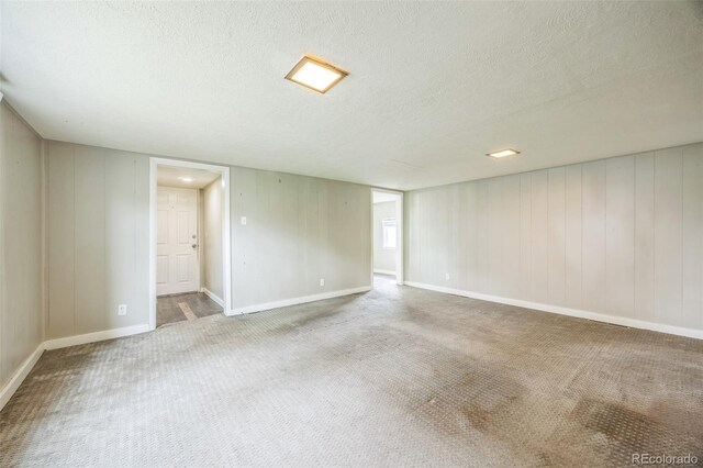 524 N 4th Ave, Sterling, CO 80751 - carpeted spare room with a textured ceiling and baseboards