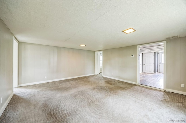 524 N 4th Ave, Sterling, CO 80751 - carpeted spare room with a textured ceiling and baseboards