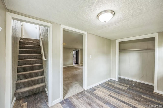 524 N 4th Ave, Sterling, CO 80751 - interior space featuring wood finished floors, a textured ceiling, baseboards, and a closet