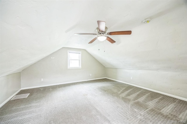 524 N 4th Ave, Sterling, CO 80751 - additional living space with baseboards, vaulted ceiling, and carpet floors