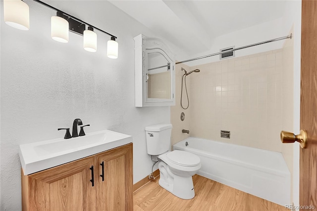 3022 S Wheeling Way Unit 205, Aurora, CO 80014 - bathroom featuring wood finished floors, vanity, and shower / washtub combination