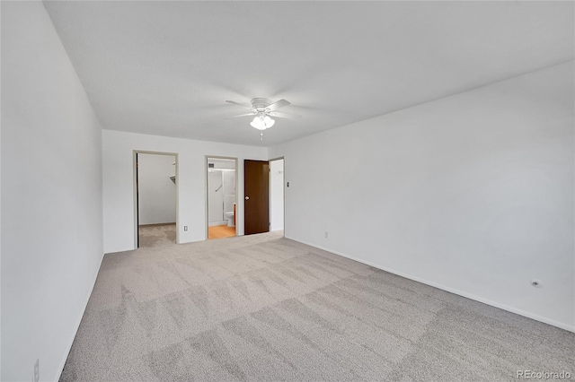 3022 S Wheeling Way Unit 205, Aurora, CO 80014 - unfurnished bedroom with light colored carpet, a walk in closet, ceiling fan, ensuite bath, and a closet