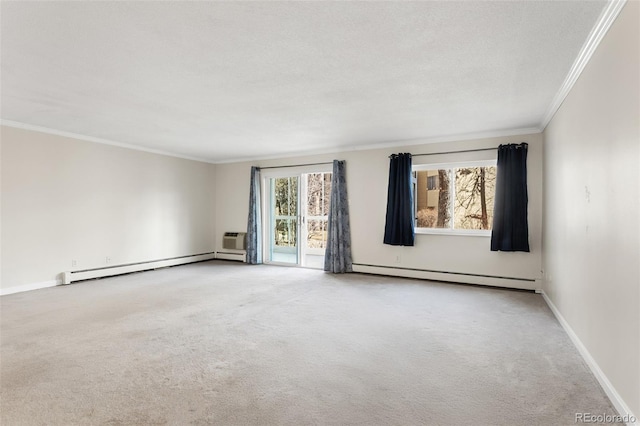 spare room with carpet floors, a baseboard radiator, ornamental molding, and baseboards