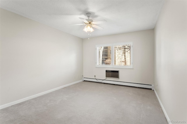 carpeted empty room with a baseboard radiator, a wall mounted air conditioner, a textured ceiling, and baseboards