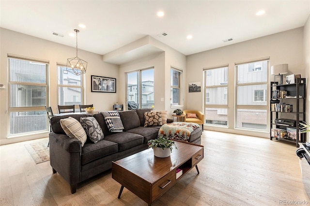 2695 W Grand Ave, Littleton, CO 80123 - living area with light wood finished floors, a chandelier, and recessed lighting