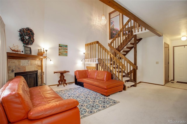 living room featuring light carpet and a tile fireplace