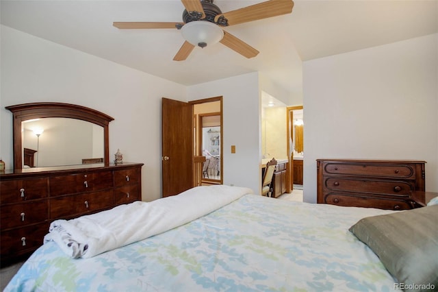 bedroom featuring ceiling fan and connected bathroom