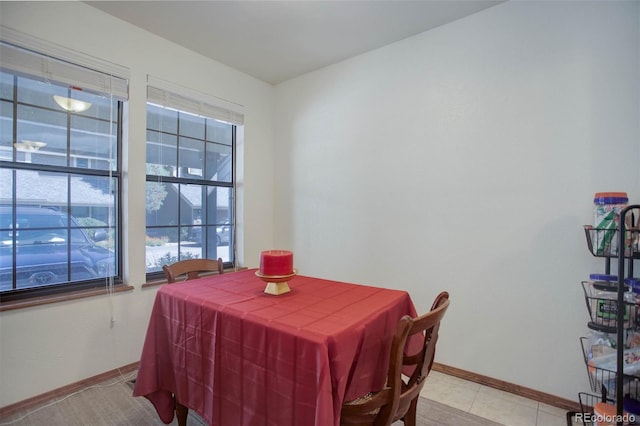 tiled dining space with a wealth of natural light