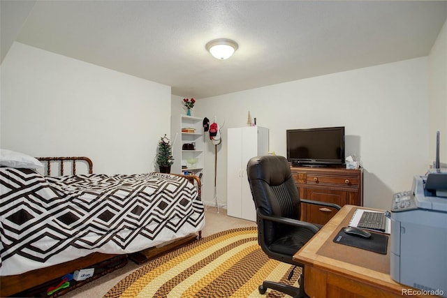 carpeted bedroom featuring a textured ceiling