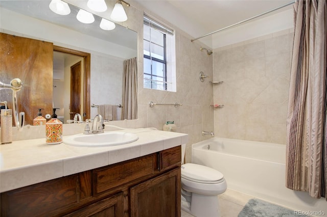 full bathroom featuring shower / bath combo with shower curtain, tile patterned flooring, vanity, and toilet