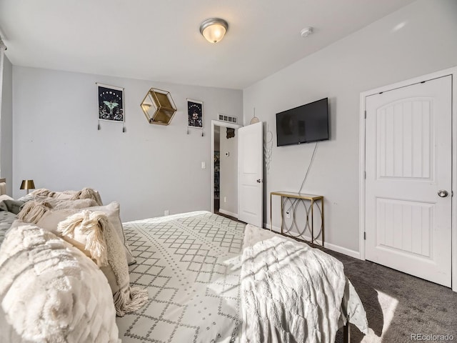 bedroom with carpet floors and baseboards