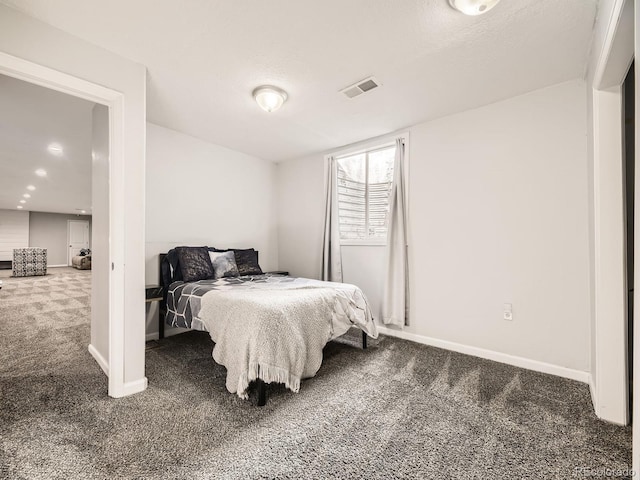 bedroom with carpet, visible vents, and baseboards