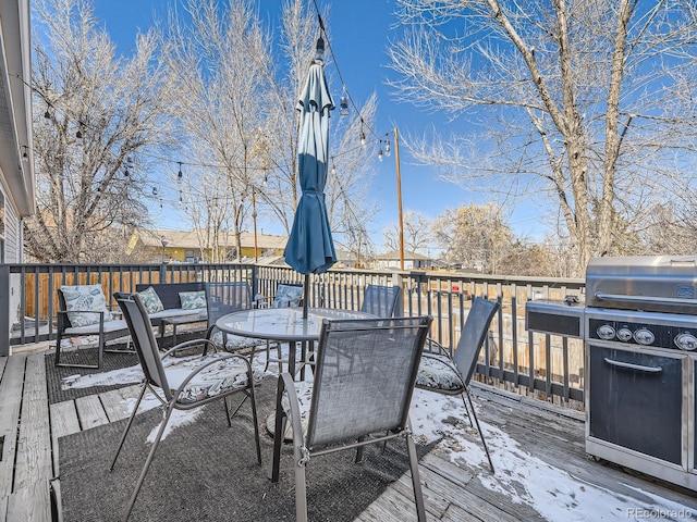 wooden terrace with outdoor dining area