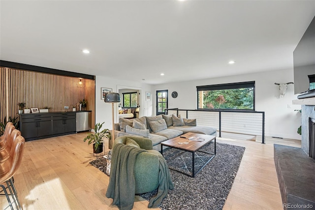 1801 Redwood Ave, Boulder, CO 80304 - living area featuring light wood-type flooring, a fireplace with raised hearth, and recessed lighting
