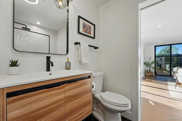 1801 Redwood Ave, Boulder, CO 80304 - full bath featuring vanity, toilet, wood finished floors, and a shower