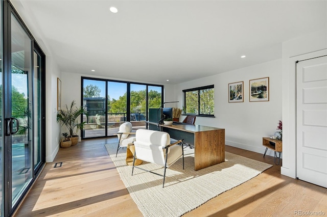 1801 Redwood Ave, Boulder, CO 80304 - home office with light wood-type flooring, recessed lighting, and baseboards