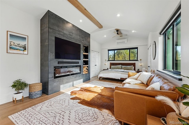 1801 Redwood Ave, Boulder, CO 80304 - bedroom featuring a wall unit AC, wood finished floors, a fireplace, recessed lighting, and baseboards