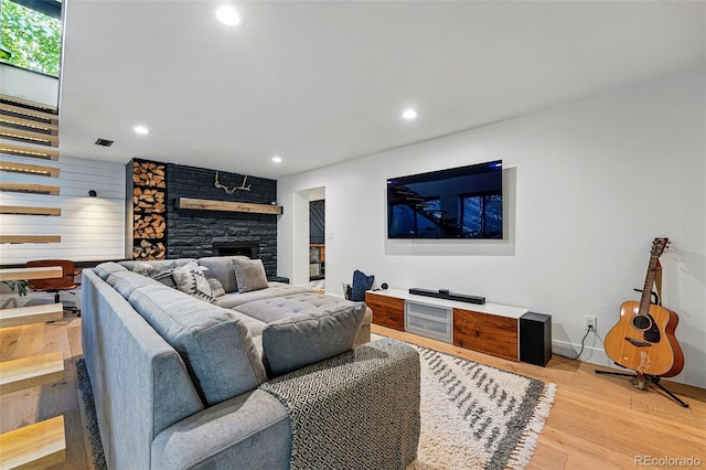 1801 Redwood Ave, Boulder, CO 80304 - living room with light wood-style flooring, a fireplace, recessed lighting, and baseboards