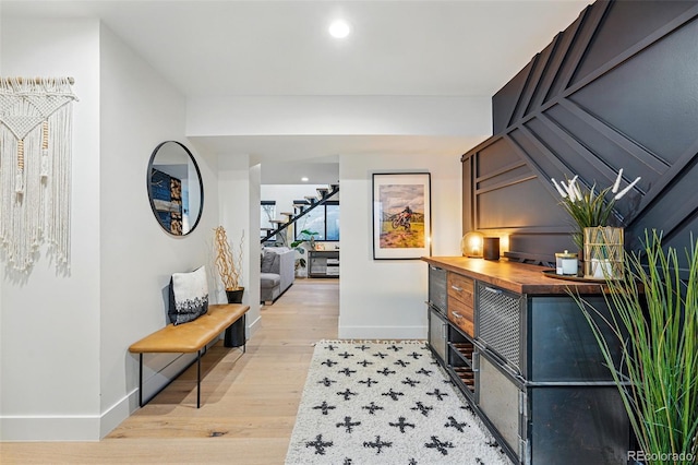 1801 Redwood Ave, Boulder, CO 80304 - hall with baseboards, light wood-style floors, stairs, and recessed lighting