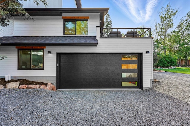 1801 Redwood Ave, Boulder, CO 80304 - view of front facade with gravel driveway and a garage