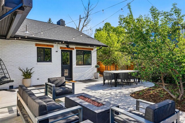 1801 Redwood Ave, Boulder, CO 80304 - view of patio with an outdoor living space with a fire pit and outdoor dining area