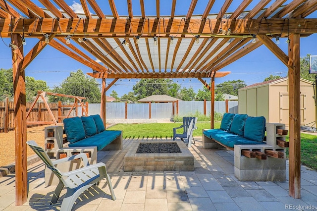 2310 Kenton St, Aurora, CO 80010 - fenced backyard featuring an outdoor living space with a fire pit, a shed, a patio area, and a pergola