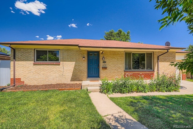 2310 Kenton St, Aurora, CO 80010 - single story home featuring brick siding and a front yard