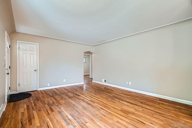 2310 Kenton St, Aurora, CO 80010 - unfurnished room featuring wood finished floors and arched walkways