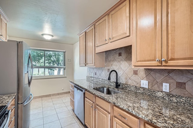 2310 Kenton St, Aurora, CO 80010 - kitchen with stainless steel appliances, backsplash, dark stone counters, and light tile patterned flooring