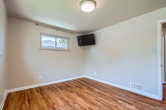 2310 Kenton St, Aurora, CO 80010 - spare room featuring baseboards and wood finished floors