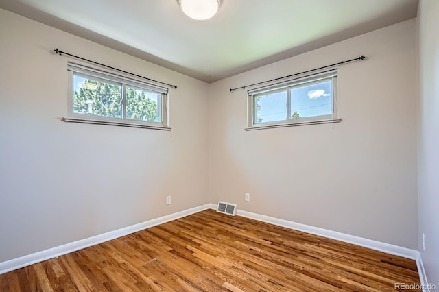 2310 Kenton St, Aurora, CO 80010 - unfurnished room featuring baseboards and wood finished floors