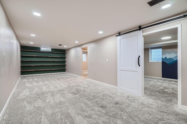 2310 Kenton St, Aurora, CO 80010 - basement featuring carpet, a barn door, recessed lighting, and stairs