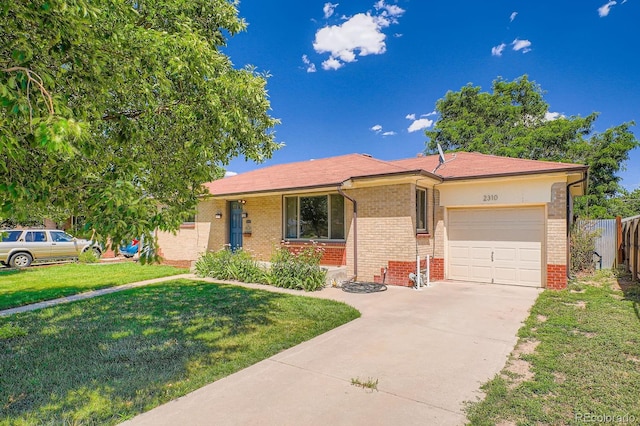 2310 Kenton St, Aurora, CO 80010 - single story home featuring brick siding, a garage, and concrete driveway