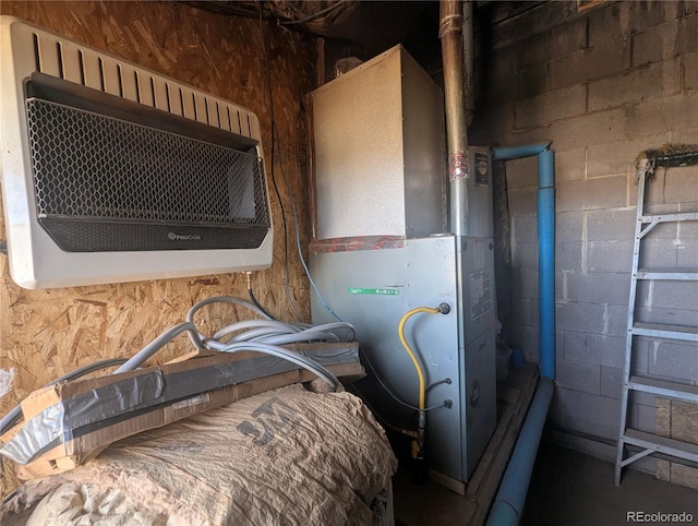 utility room with heating unit