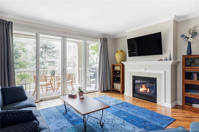 111 S Monroe St Unit B106, Denver, CO 80209 - living room featuring wood finished floors, ornamental molding, and a glass covered fireplace